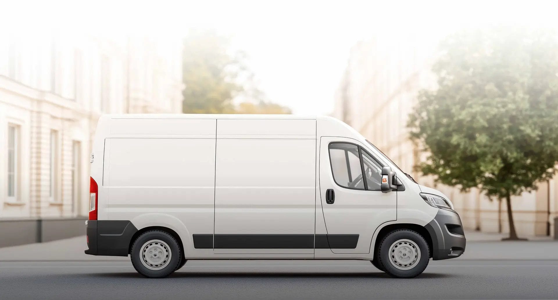 White delivery van on a city street used as the website footer background